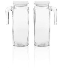 two clear glass pitchers with handles on each side