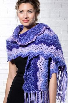 an advertisement for a candy shop featuring a woman wearing a purple crochet shawl