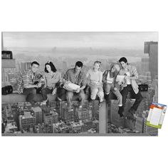 black and white photograph of four people sitting on top of a building in new york city