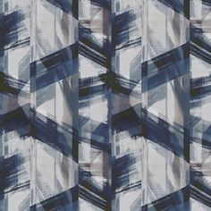 an abstract pattern made up of squares and rectangles in shades of blue, white, gray and black