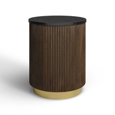 a black and gold side table with a round top on the bottom, in front of a white background