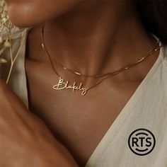 Discover the beauty of our Custom Name Necklace, a timeless piece that lets you carry your name or the name of someone special close to your heart. Crafted with meticulous attention to detail, this elegant necklace features a beautifully scripted nameplate in a luxurious gold-plated finish. Perfect for any occasion, this personalized necklace makes a thoughtful gift for birthdays, anniversaries, graduations, or simply as a treat for yourself. The necklace is designed to add a touch of sophistication and individuality to any outfit. Features: Personalized Design: Customizable with any name or word of your choice, up to 12 characters. Luxurious Finish: High-quality gold plating for a rich, polished look. Elegant Script: Beautifully crafted in an elegant script font that captures the essence Necklace Chain Types, Gold Name Necklace, Nameplate Necklace, Silver Chain Style, Name Jewelry, Custom Name Necklace, Custom Necklace, Perfect Gift For Her, Stainless Steel Necklace