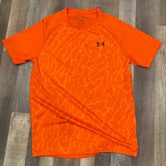 Under Armour Tshirt Size S Lightweight Brand New Without Tags Orange Crew Neck Sports Top, Orange Crew Neck Top With Graphic Print, Under Armour Sporty T-shirt With Letter Print, Under Armour Sporty Tops With Letter Print, Under Armour Crew Neck Top With Letter Print, Under Armour Crew Neck T-shirt With Logo, Sporty Under Armour Tops With Letter Print, Orange Crew Neck T-shirt With Moisture-wicking, Orange Moisture-wicking Short Sleeve Tops