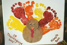 a turkey handprinted on a canvas with the words happy thanksgiving written in it