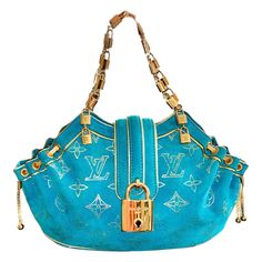 A stunning turquoise suede by Louis Vuitton This bag was produced in a limited edition and made to order for LV‘s 150th anniversary celebration Finest suede leather imprinted with the famous LV monogram logo in golden color Large decorative lock in front LV logo lock chain Golden hardware Lined with champagne-colored satin fabric Made in France Please refer to celebrity and AD pictures for season reference only, the actual bag for sale is visible on pictures 1-10 Louis Vuitton Bag Collection, Vintage Louis Vuitton Bag, Rare Louis Vuitton, Dream Bags, Louis Vuitton Clutch, Luxury Bags Collection, Louis Vuitton Limited Edition, Handbag Essentials, Luxury Purses