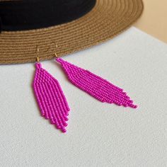 These fuschia beaded earrings with fringe are created for lovers of bright summer accessories. Inspired by tribal style, these statement waterfall earrings are made from high-quality Czech seed beads and supplied with stainless steel accessories. This pair would be a great choice if you need bold seed bead earrings or an accessory in hot pink, neon pink, or magenta color. 100% top-quality handmade earrings.  Materials:  - Czech beads - stainless steel closure. Length: 3.94'' / 10 cm Width: 0.8'' / 2 cm The real color of the item may be slightly different from the picture shown on website caused by the brightness of your monitor. If you have special size requirements, please send me a letter about it, as this can be made to order. More beadwork earrings: https://etsy.me/30peGhg Back to shop Magenta Earrings, Summer Earrings, Summer Earring, Pink Summer, Seed Bead Earrings, Czech Beads, Bead Earrings, Summer Accessories, Chandelier Earrings