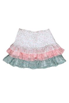 Show off your passion for petals and cottagecore style in this adorable skirt from Divine Heritage! The floral print and ruffle design of this skirt is perfect for a spring outing or even for your Easter brunch outfit! Wear it with a pastel tank and a jean jacket for a fresh and flouncy look. Size S 100% Polyester Fully lined Concealed side seam zipper closure Faux buttons at front Waist 24" Hip 30" Total length 15.5" Feminine Floral Mini Skirt For Spring, Multicolor Tiered Skirt With Floral Print, Feminine Tiered Mini Skirt For Spring, Tiered Mini Skirt For Spring, Tiered Flowy Mini Skirt For Spring, Ruffled Bottoms For Spring Garden Party, Ruffled Bottoms For Garden Party In Spring, Spring Multicolor Floral Patchwork Skirt, Spring Tiered Skirt For Garden Party