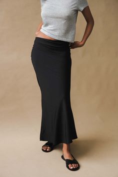 Geel verve skirt in black jersey. the verve a full length bias skirt with a hidden elastic waistband. a simple but strong statement piece. fits true to size. model is wearing a size small.    40 inch length.    100% polyester.    pipe and row Black Full-length Stretch Skirt, Black Stretch Elastane Maxi Skirt, Full Length Stretch Black Skirt, Black Full Length Stretch Skirt, Black Fitted Maxi Pencil Skirt, Black Fitted Pencil Maxi Skirt, Black Full-length Lined Maxi Skirt, Black Elastane Long Skirt, Fitted Black Long Pencil Skirt