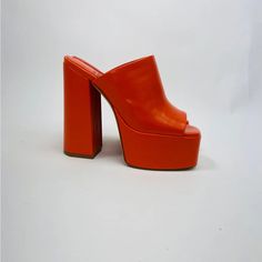 Brand New, Never Used Only Tried On In Store. Fits True To Size. Will Update Photos Soon! Fall In Luv With The The Luna Luv Platform Mule In Orange! These Chunky Open-Toe Platforms Are Both Playful And Elevated, And Pair Perfectly With Any Flare Style Pant. Pair It With A Light Washed Jean For A Daytime Look Or Channel Your Y2k Vibes And Pair Them With Your Favorite Mini Skirt! Faux Leather Upper With Manmade Sole Slip-On Styling Leather Lining Approx 5.25 Inch Heel Approx 2 Inch Platform Synthetic Block Heels With Red Sole, Bold Round Toe Heels For Spring, Bold Spring Heels With Round Toe, Spring Closed Toe Heels With Red Sole, Bold Heels With Round Toe, Red High Heel Platform Mules, Spring Leather Heels With Red Sole, Bold Platform Heels With Round Toe, Spring Synthetic Heels With Red Sole