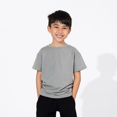 Elevate their wardrobe with our Stormy Grey Bamboo Terry Daywear Kids T-Shirt. Soft, cozy, and effortlessly cool, this tee is perfect for playdates or lounging at home. Made from sustainable bamboo fabric, it's gentle on the skin and the planet. Add a touch of sophistication to their ensemble with Stormy Grey! Versatile and Stylish: Perfect for both indoor and outdoor activities, this versatile tee pairs effortlessly with jeans, shorts, or joggers for a stylish look. Breathable and Moisture-Wick Social Impact, Bamboo Fabric, Oversized T Shirt, Oversized Tshirt, Home Made, Jeans Shorts, The Well, Outdoor Activities, Chemicals