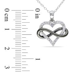 This charming diamond pendant is a meaningful way to say, "My heart is forever yours." Crafted in sleek sterling silver, this design pairs an outlined heart, lined with shimmering diamonds, with a looping infinity symbol, finished with bold black rhodium plating. Locked in an everlasting embrace, this 1/10 ct. t.w. diamond pendant is polished to a brilliant shine and suspends along an 18.0-inch cable chain that secures with a spring-ring clasp. Sterling Silver Infinity Heart Necklace For Anniversary, Silver Infinity Heart Necklace For Anniversary, Infinity Heart, Peoples Jewellers, Infinity Symbol, Forever Yours, Black Rhodium, Bold Black, Cable Chain