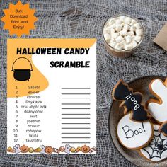 a halloween candy scramble is shown on a plate with marshmallows and candies