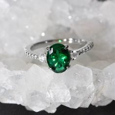 Oval Green Emerald Gemstone carefully crafted into sterling silver with the option of 14k rose gold vermeil, paired with a Unique Crown Band Main ring Gemtype: Lab Created Emerald Main stone size: 6x8mm Stone clarity:vvs Meatl Type:Sterling Silver, 14k rose gold plated Metal Stamp: 925, S925 Stone Origin:Russia Ring band Metal: sterling Silver, 14k rose gold vermeil Stone: Cubic Zirconia Metal Stamp: s925 Packaged in a gift ready box. IMPORTANT: Sizes fit true, please always make sure of your ri Oval Emerald Ring In 14k White Gold, Classic Oval Tsavorite Ring, Oval Tsavorite Ring In White Gold, Oval Tsavorite White Gold Ring, Elegant Oval Solitaire Gemstone, Oval Tsavorite Ring With Center Stone, Oval Emerald Gemstone With Center Stone, Oval Emerald Gemstones With Halo Setting, Oval Tsavorite Rings With Halo Setting