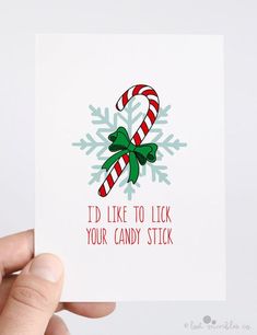 someone holding up a card with candy canes on it and the words i'd like to lick your candy stick