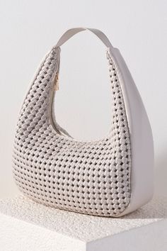 Carry all of your summer essentials in style with Shiraleah's Monroe Hobo. Made of elegant handwoven vegan leather, this purse is your new favorite summer handbag. Its single shoulder strap allows you to wear it easily over your arm. Pair with other items from Shiraleah to complete your look! Spring Crochet Crossbody Bag With Braided Handles, Chic Braided Straw Bag For Day Out, Versatile Natural Hobo Bag With Braided Handles, Chic Crochet Bag With Detachable Strap For Vacation, Chic Beige Braided Bucket Bag, Beige Braided Bags For Day Out, Chic Beige Braided Bag, Chic Braided Bag For Day Out, Chic Braided Beige Bags