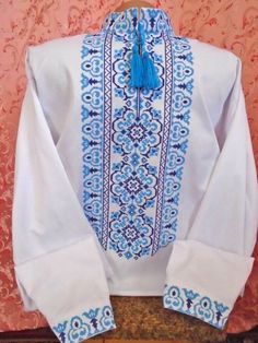 Ukrainian Embroidered Shirt for men   Cross stitch XS-4XL Material cotton, embroidery cross Pattern blue and dark blue thread. Perfectly complements your wardrobe. Beautiful and original gifts. Main characteristics: Fabric  - cotton. Technique - cross-stitch Embroidery machine stitch! Shirt size is measured by volume of the neck. Direct style free. You can order any size XS - 4XL! When ordering please tell me the circumference of the chest, waist and hips.  We will choose the right size for you! Ukrainian Cross Stitch, Blouse Design Latest, Embroidery Blouses, Ukrainian Style, Stitch Shirt, Embroidery Cross, Blouse Designs Latest, Original Gifts, Embroidery Blouse Designs