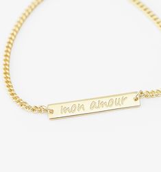 Who says subtle can't be powerful? The small bar bracelet keeps your reminder short and sweet on this polished piece of minimal thoughtfulness. Personalized Yellow Gold Rectangular Name Bracelet, Personalized Rectangular Yellow Gold Name Bracelet, Rectangular Yellow Gold Name Bracelet, Gold Rectangular Name Bracelets, Rectangular Gold Name Bracelets, Gold Rectangular Name Bracelet, Tarnish Resistant, Gold Personalized Name Bracelet Rectangular Shape, Gold Nameplate Chain Bracelet, Personalized Gold Rectangular Chain Bracelet