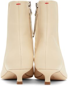 Ankle-high LWG-certified grained nappa leather boots in off-white. · Pointed toe · Zip closure at inner side · Red stitch at heel tab · Grained lambskin lining · Kitten heel with rubber injection · Nubuck sole with rubber injection · Heel: H1.25 Supplier color: Creamy Beige Calf Leather Boots With Reinforced Heel, Cream Leather High Ankle Boots, High Ankle Cream Leather Boots, Cream Leather High Ankle Heeled Boots, Cream High Ankle Heeled Leather Boots, Beige Calf Leather Boots With Sculpted Heel, Cream High Ankle Leather Booties, Modern Beige Calf Leather Boots, Cream Leather Boots With Sculpted Heel