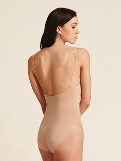 Capezio's seamless camisole undergarment includes nude and clear adjustable shoulder straps. The back neckline has six hook positions for versatile adjustment. The seamless Tactel Nylon blend contours and shapes the dancer's body. Moderate cut leg line. Machine wash in cold water, hang dry. Capezio Adult Seamless Camisole Undergarment Nude XL 3680 Sleeveless Micro-elastic Bodysuit With Built-in Bra, Second-skin Bodysuit With Spaghetti Straps And Built-in Bra, Solid Cami Bodysuit With Built-in Bra, Stretch Leotard With Built-in Bra And Scoop Neck, Summer Shapewear Camisole With Built-in Bra, Elegant Second-skin Camisole With Built-in Bra, Scoop Neck Shapewear With Built-in Bra, Shapewear Leotard With Built-in Bra, Second-skin Shapewear Leotard With Built-in Bra