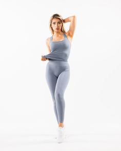 HIGHLIGHTS. Moisture-wicking, breathable fabric. Unbelievably soft texture. Alphalete core wordmark Seamless construction. Reinforced binding arm and neckline finishing FIT SUGGESTION. This item runs true to Alphalete's standard seamless fit.. If you are between sizes, we recommend sizing up.. Model is 5’7”/170cm, wearing a size XS with a 33.5”/85cm bust.. MATERIALS AND WASHING DIRECTIONS. 51% Polyamide, 38% Polyester, 11% Elastane. We recommend washing inside-out on a cold setting. Hang to dry Moisture-wicking Micro-elastic Tops For Gym, Breathable Micro-elastic Workout Tops, Seamless 4-way Stretch Sportswear Activewear, Seamless 4-way Stretch Activewear Sportswear, Micro-elastic Solid Tops For Workout, Stretch Seamless Fabric Sports Tank Top, Athleisure Seamless Fabric Tank Top For Sports, Athleisure Seamless Tank Top For Sports, Seamless 4-way Stretch Activewear For Sports