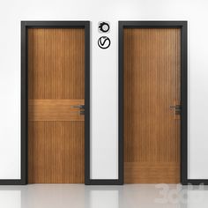 two wooden doors in front of a white wall