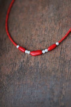 This feminine delicate necklace was made of 3 natural red coral stone beads, 6 white pearl coated pastic beads, tiny red irregular shape glass seed beads, stainless steel end clasps, double strong nylon thread, stainless steel lobster claw and stainless steel adjustable length chain. You can wearing it with other necklaces or alone! The length of necklace is about 41 cm or about 16.1 inches and about 5 cm of adjustable length stainless steel chain. Other necklaces of my shop you can see here: https://www.etsy.com/shop/NaTavelli?section_id=14843046&ref=shopsection_leftnav_5 Thanks for a visit. Red Minimalist Beaded Necklace With Tiny Beads, Minimalist Red Beaded Necklace With Tiny Beads, Red Pearl Jewelry With Colorful Beads, Red Pearl Necklace With Gemstone Beads, Handmade Adjustable Red Pearl Necklace, Minimalist Red Beaded Necklaces, Adjustable Red Pearl Necklace, Red Pearl Necklace With Polished Beads As A Gift, Gift Red Pearl Necklace With Polished Beads