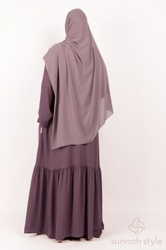 Our Lily Tiered Abaya offers simple elegance that can be worn everyday, in professional settings, or dressed up for special occasions.  The abaya is designed with a closed front and stretch cuffs that keep your arms covered while still giving the option to roll up your sleeves.  It has side pockets for conveniently storing your keys, phone and other necessities and includes belt loops and a matching belt that can be used if desired.

Our Lily Tiered Abaya is made from quality crinkle crepe which is lightweight and uniquely textured, making it wrinkle resistant.  The fabric has a textured grain for breathability, a slightly silky feel that modestly falls away from the body, and is suitable for all seasons. Layered Abaya Designs, Chiffon Layered Abaya, Mauve Abaya Outfit, Luxury Modest Floor-length Abaya, Elegant Floor-length Solid Abaya, Hijab Pins, Muslim Outfits, Clothing Care, Simple Elegance