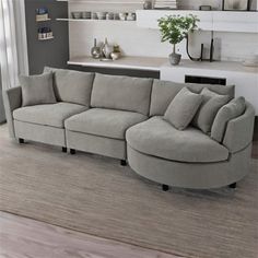 a living room with a large sectional couch