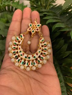 Premium quality gold-plated kundan chandbali earrings with moti (pearls). Very gorgeous pair. Care Instruction: Avoid heat & substances like perfume, deodorant, alcohol, etc and clean with silver/gold polish cloth. Store in airtight spaces like ziplock pouch or jewelry box. Elegant White Chandbalis With Meenakari, Elegant White Meenakari Chandbalis, White Cutdana Bridal Earrings, Traditional White Bridal Earrings As Gift, White Kundan Temple Jewelry Earrings, White Kundan Chandbali Pearl Earrings, Kundan Pearl Earrings As Diwali Gift, Heavy Kundan Chandbalis In White, Heavy White Kundan Chandbalis