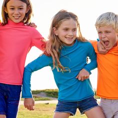 Shop Teal Long Sleeve Rash Guard Tops for boys or girls 2-16 years old. Chemical-free UPF 50+ fabric blocks 99% of UV sun rays. Made in the USA. Hello, Pop of Color! Enjoy outdoor fun with happy, bright and colorful worry-free sun protection. Sun Pop Life Long Sleeve Rash Guard Tops UPF 50+ in bright colors will protect your kid’s upper body during extended sun exposure from ultraviolet rays. These stylish and comfortable long sleeve tops go with everything and will protect your kids from all el Playful Blue Rash Guard With Uv Protection, Casual Upf 50+ Rash Guard For Swimming, Playful Blue Rash Guard For Playwear, Casual Rash Guard With Upf 50+ For Outdoor Activities, Playful Blue Rash Guard For Swimming, Playful Blue Rash Guard For Beach, Long Sleeve Swimwear With Upf 50+ For Play, Blue Rash Guard With Uv Protection For Playwear, Playful Upf 50+ Rash Guard For Swimming