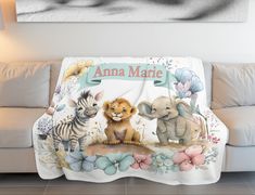 an animal themed personalized blanket on a couch