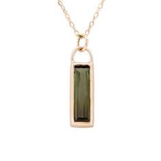 "details  ✧ Pendant size ~ 19.5mm x 6.75mm ✧ Green Tourmaline ✧ Chain Length ~ 18 inches with the option to wear at 16 inches ✧ Diamond Cut Boston Link Chain ✧ 14k Yellow Gold ~ setting & chain description Baguette-cut gemstones have always been a favorite cut of mine, but an elongated baguette really makes my heart pitter-patter.  The dramatic shape mixed with the deep dark green color of this tourmaline makes for a rich pendant. Set vertically, this pendant hangs from an 18-inch chain diamond Black Tourmaline Necklace, Chain Diamond, Dark Green Color, Tourmaline Earrings, Tourmaline Pendant, Dainty Chain, Rose Quartz Ring, Tourmaline Necklace, Green Gems