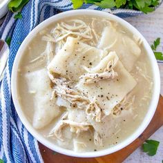 a white bowl filled with chicken noodle soup