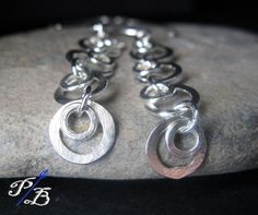 "Earrings made using all of our sterling silver handmade components. They hang about 3\" from top of ear wire. Nice and lightweight! All of our jewelry will arrived boxed and ready to give as a gift. Please email us if you have any questions. Made to order Θ Allow up to 14 business days before shipment Θ VISIT OUR SHOP: http://www.PoseidonsBooty.etsy.com SHOP POLICIES: http://www.etsy.com/shop/PoseidonsBooty/policy" Nickel-free Long Drop Sterling Silver Earrings, Hypoallergenic Sterling Silver Long Drop Linear Earrings, Hypoallergenic Sterling Silver Dangle Linear Earrings, Hypoallergenic Long Drop Sterling Silver Linear Earrings, Handmade Long Drop Hoop Earrings In Sterling Silver, Hand Forged Sterling Silver Long Drop Jewelry, Handmade Silver Sterling Linear Earrings, Silver Sterling Long Drop Hoop Earrings, Hand Forged Silver Jewelry With Long Drop Shape