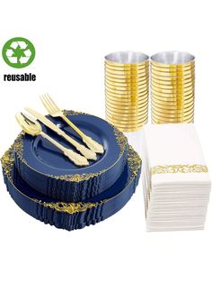 a set of gold and blue plates with napkins, forks and spoons on them