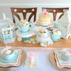 vintage birdcage teapot centerpieces with flowers in them