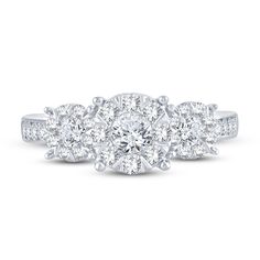 three stone engagement ring with round diamonds in the center and side stones on each band