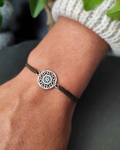 Bohemian chic Mandala Flower life bracelets for woman in silver brass and macrame. Fine and discreet it will match with all your outfits, in casual mode or for an evening it will have its effect. Unique model to offer or offer. Handmade in micro-macrame with very fine waxed thread of high quality, resistant to water and sun. Comfortable material to wear against the skin, which will not lose its color or shape over time. Dimensions: Size adjustable to all wrists thanks to the sliding knot. Strap Bohemian Nickel-free Friendship Bracelets As Gift, Handmade Sterling Silver Braided Bohemian Bracelets, Handmade Sterling Silver Bohemian Braided Bracelets, Adjustable Bohemian Sterling Silver Braided Bracelet, Silver Macrame Spiritual Bracelets, Silver Macrame Jewelry For Festivals, Silver Macrame Jewelry For Festival, Silver Bohemian Friendship Bracelets For Festivals, Handmade Sterling Silver Friendship Bracelets