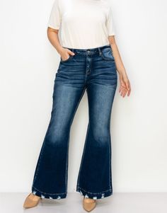 Embrace vintage vibes with ARTEMIS VINTAGE Mid Rise Flare Jean. These dark wash jeans feature a unique distressed hem for that extra touch of style. With a mid rise fit and luxurious stretch, they're both comfortable and chic. Perfect for spicing up any outfit.PRODUCT SPECIFICATIONS*Wide Hem with Distressed Detail*Mid-Rise Stretch Denim*Dark Stone Wash*Front Rise: 12 1/2", Inseam: 32.5"*Brand: Artemis Vintage*Online Only Vintage Flare Jeans With Frayed Hem For Fall, Vintage Washed Blue Bottoms For Fall, Vintage Flare Jeans With Frayed Hem For Spring, Spring Vintage Flare Jeans With Frayed Hem, Fall Distressed Dark Wash Flare Jeans, Retro Bottoms With Frayed Hem For Fall, Retro Fall Bottoms With Frayed Hem, Retro Frayed Hem Jeans For Fall, Vintage Medium Wash Flare Jeans For Fall