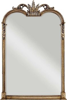 an ornate gold framed mirror on a white background