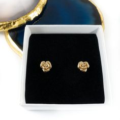 These pretty gold rose stud earrings make the perfect little gift for young or old. Great for a birthday or thank you gift. Dimensions: 0.7cm x 0.7 cm. (Rose excluding pin)Earrings will be delivered in an Aspreys & Clarke Gift box. For that extra special touch you can personalise the gift box. The box lid can be completed with an engraved plaque, allowing you to add a message up to 120 characters in length.This product will be engraved using ‘Georgia’ font unless otherwise stated. Gift Gold Flower Earrings Tarnish Resistant, Yellow Gold Rose Design Earrings As Gift, Gold Rose Design Earrings For Anniversary, Yellow Gold Earrings With Rose Design For Gift, Gold Tarnish-resistant Flower Earrings For Gift, Yellow Gold Earrings With Rose Design As Gift, Dainty Rose Gold Flower Earrings Gold Plated, Classic Rose Design Jewelry For Gifts, Gold Tarnish-resistant Flower Earrings Perfect For Gifts