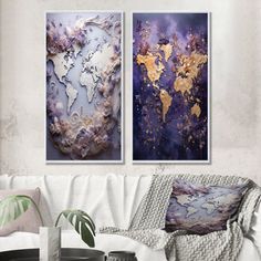 two paintings hanging on the wall in a living room