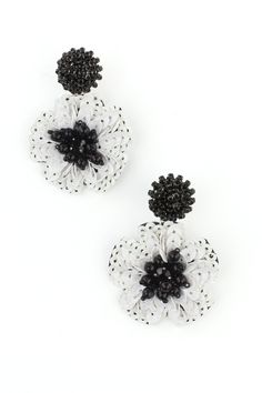 Black and white sequin and bead dangle earrings. Pierced Style Backing Black and White White Beaded Earrings For Spring Party, White Drop Flower Earrings For Party, White Flower Drop Earrings For Parties, Elegant Black Earrings For Spring, Elegant Beaded Earrings For Spring Party, Elegant Spring Beaded Earrings For Party, Elegant Spring Party Beaded Earrings, White Beaded Earrings For Spring, White Dangle Flower Earrings For Party