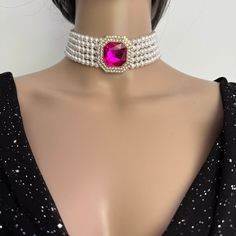 Make a statement with this Layered Pearl Choker Necklace with 5 layers of pearls and stunning pink diamanté brooch. Materials: 6mm Luxurious Shell Pearls, Rhinestones brooch, Gold plated brass clasp. Shell pearls are made from crushed shells. Oyster shells are cut and transformed into powder and then reformed into perfect pearl shape with an infinite shine. They are very popular as a natural alternative to expensive pearls.  Each glossy bead is crafted to mimic the radiant beauty of real pearls, Pearls Choker, Radiant Beauty, Oyster Shells, Pearl Choker Necklace, Real Pearls, Pearl Choker, Rhinestone Brooches, Pink Rhinestones, Beaded Choker