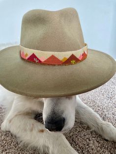 "This hatband was hand beaded with over 5,000 seed beads. There is over 20 1/2\" of beading and has adjustable ties to fit any hat. It will dress up any outfit!   This is made to order so each hat band is a little unique. The color of the \"sky\" is a cream by default but if you would like white please make a note (last picture shows both).   Shipping time and manufacturing process Each hatband is made to order, so your order will ship within a week to two weeks." Luxury Fitted Cream Hat Band, Beaded Hat Brim Patterns, Beaded Hats, Burned Hats, Mountain Hat, Beaded Hat Bands, Beaded Crown, Hat Art, Hat Bands