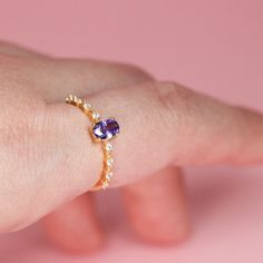 These purple stone ring features beautiful egg shape purple color stone at center and the cubic zirconia stone surrounding band, made of soli 925 sterling silver and 18k gold plated to give it high end luxury look. Available in size US 6,7,8 Shipping Policy: Order will be shipped within 1-3 business days. First class mail will take 7-14 days to arrive for U.S. orders. International shipping time is vary per shipping method. Contact us to get more details. Return Policy: Free return within 30 day Oval Amethyst Cubic Zirconia Promise Ring, Oval Amethyst Ring With Cubic Zirconia And Gemstone Accents, Oval Amethyst Ring With Cubic Zirconia For Promise, Oval Amethyst Ring With Cubic Zirconia Accents, Oval Amethyst Cubic Zirconia Ring, Oval Purple Amethyst Ring With Cubic Zirconia, Oval Amethyst Ring With Cubic Zirconia, Elegant Purple Oval Birthstone Ring, Oval Cubic Zirconia Ring With Gemstone Accents