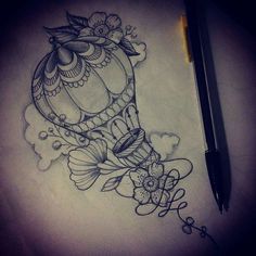 a drawing of a hot air balloon with flowers on it and a pen in the foreground