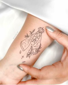 a woman's arm with a tattoo on it