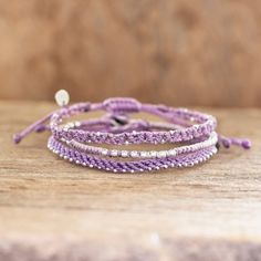 This pretty set of three bracelets is from the artisans of Wakami an artisan cooperative in Guatemala. The macrame bracelets are crafted from lavender waxed polyester cord and embellished with silvery glass and Zamac beads. Sliding knots on two of the bracelets allow you to adjust the length as desired. The third bracelet features a button clasp with the Wakami logo. Beaded Macrame, Thread Bracelet, Thread Bracelets, Lovely Lavender, Buy Bead, Sliding Knot, Macrame Bracelets, Guatemala, Silver Beads