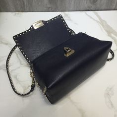 SHOP MORE LUXURY PRODUCTS HERE Description Valentino Rivet Rockstud Bag Dark Blue, For Women, Women’s Bags 11.8in/30cm Size:ÃƒÂ¯Ã‚Â¿Ã‚Â½ÃƒÂ¯Ã‚Â¿Ã‚Â½ÃƒÂ¯Ã‚Â¿Ã‚Â½ÃƒÂ¯Ã‚Â¿Ã‚Â½ 30 x 13 x 6 cm /11.8 x 5.1 x 2.4 inches (Width x Height x Length) Valentino new ROCKSTUD grained tote, original grained with plating rivets, hand inlaid, comfortable and three-dimensional package, exaggerated personality, never follow the crowd, strong punk style, with long shoulder strap, portable Includes dust bag.Thi Evening Shoulder Bag With Studs, Studded Evening Shoulder Bag, Luxury Studded Shoulder Bag, Studded Shoulder Bag For Everyday Use, Crossbody Style, Everyday Studded Bags, Studded Rectangular Bag For Everyday Use, Elegant Leather Bag With Studs, Studded Crossbody Bags For Everyday Use, Studded Leather Crossbody Bag